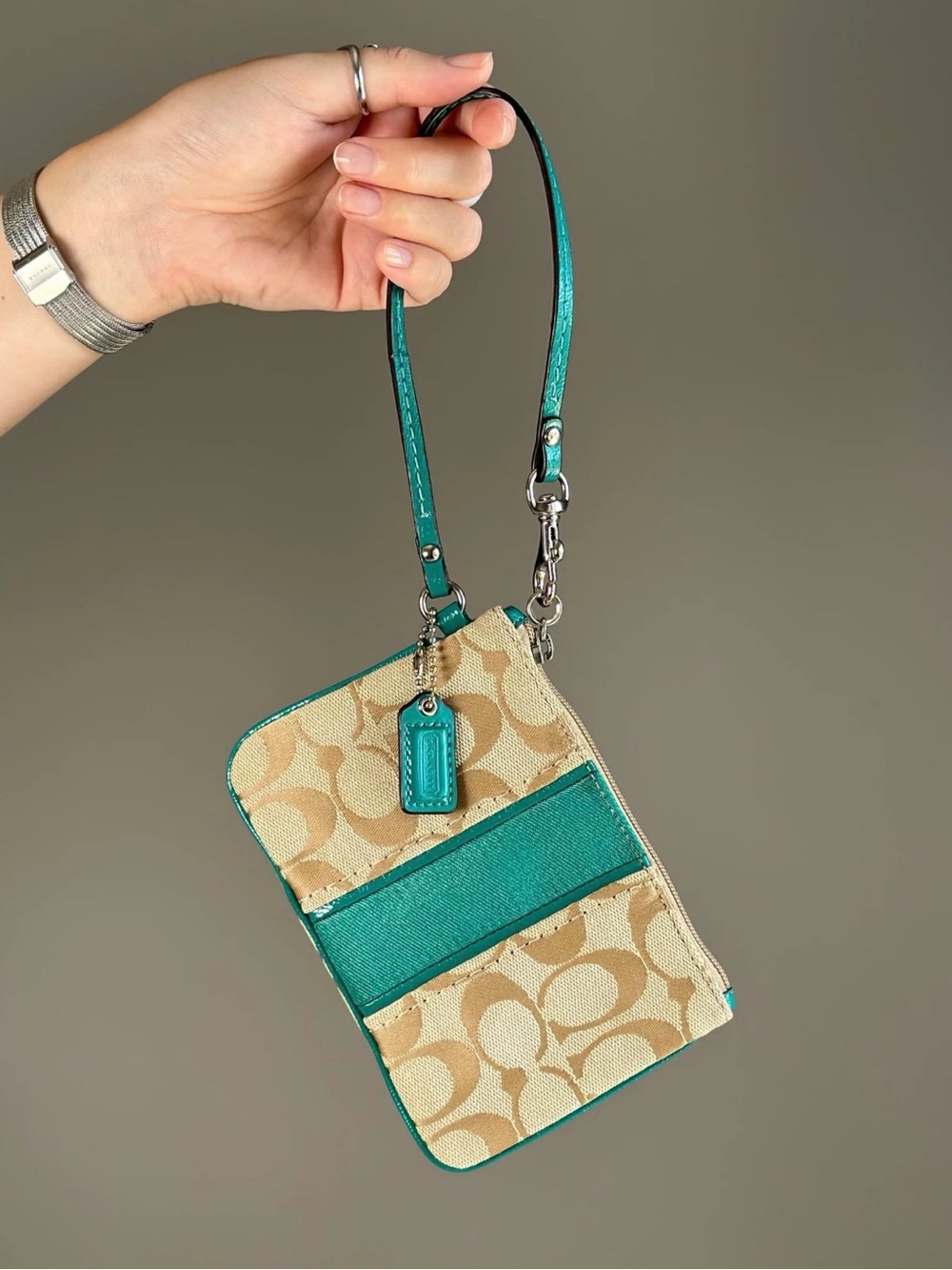 Coach signature monogram wristlet with teal leather trim
